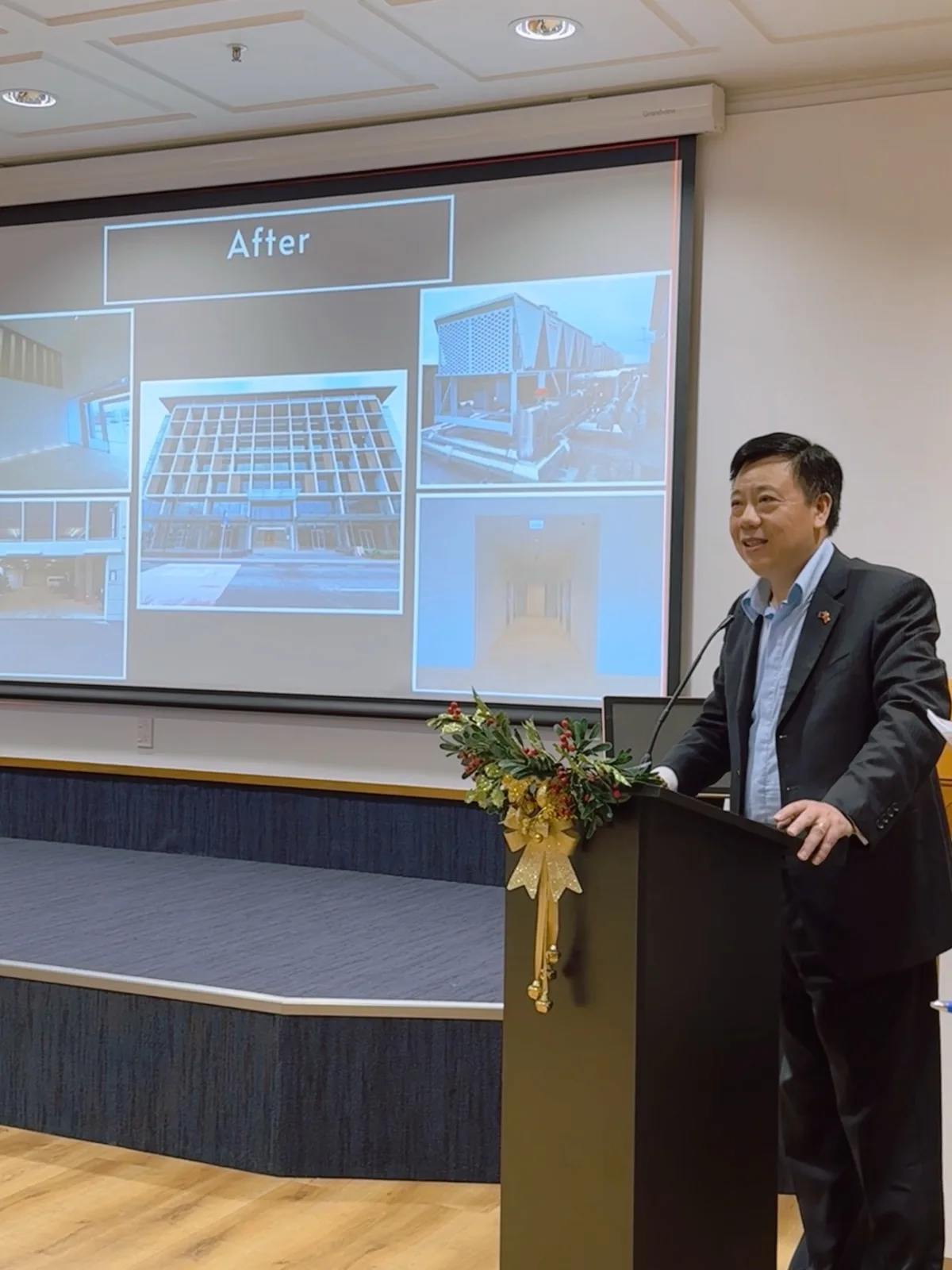 JP Wang, Chairman, speaking at a Huadu Group conference